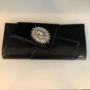 New with tags black leather clutch